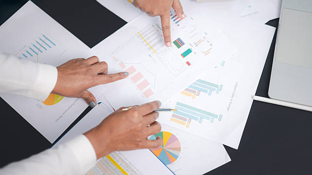 istock Business team analyzing financial report and marketing data chart for strategy planning 2245512316