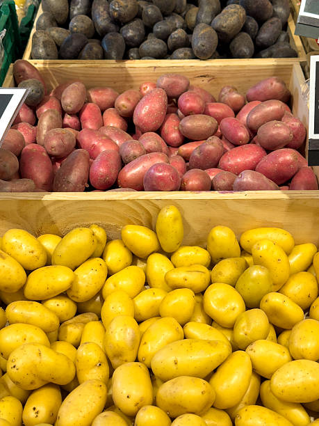 istock Different varieties of potatoes on market stall 2245514751