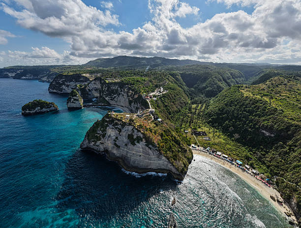istock stormy coast with sunlight shining, rugged coastal headlands against stormy clouds and bright Diamond Beach Nusa Penida Bali 2245516792