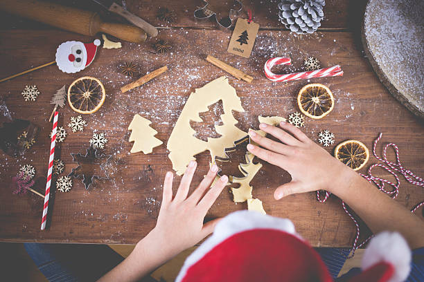 istock Child preparing Christmas cookies 2245519018