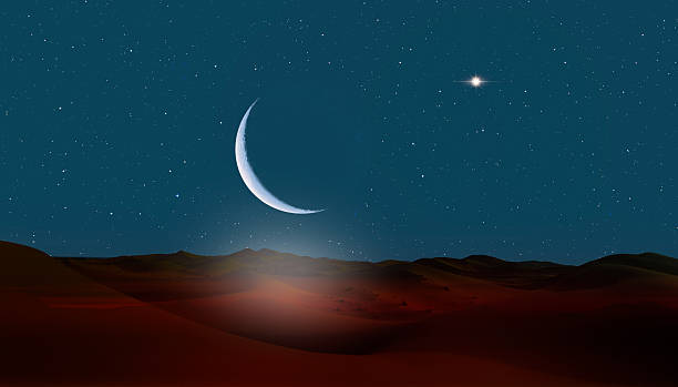 istock Night sky with crescent moon in the clouds on the foreground hot desert (sand dune) 2245519647