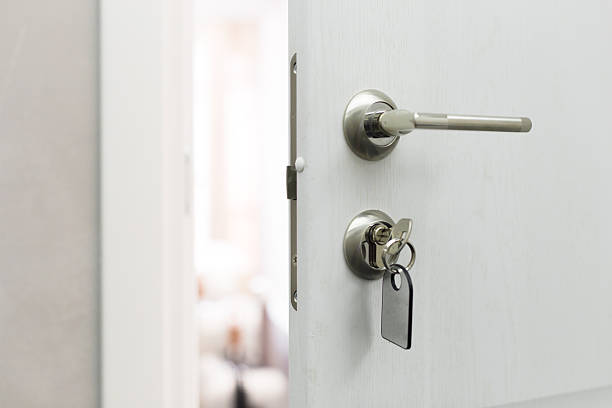 istock Door with keys left in lock, inviting entry and exploration into a new space 2245520261