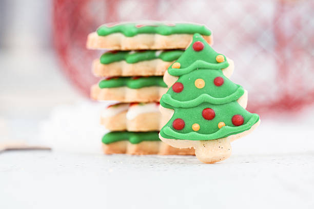 Woman holds the Christmas cookies she made