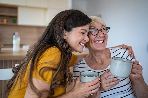 istock Mother and daughter bonding over coffee at home 2245521794