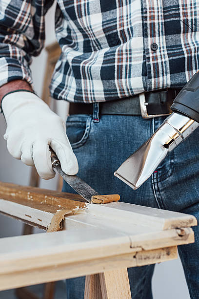 istock Carpenter at work, restoring an old wooden window. Carpentry. 2245531682