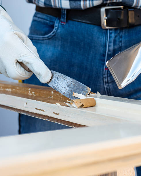 istock Carpenter at work, restoring an old wooden window. Carpentry. 2245531719