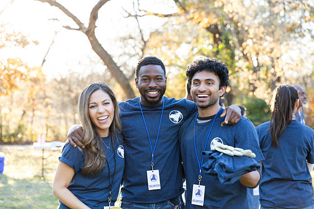 istock Volunteers share smiles outdoors, contributing to community and teamwork. 2245532733