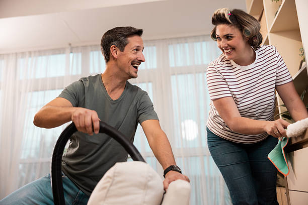 istock Couple Cleaning Home 2245537793