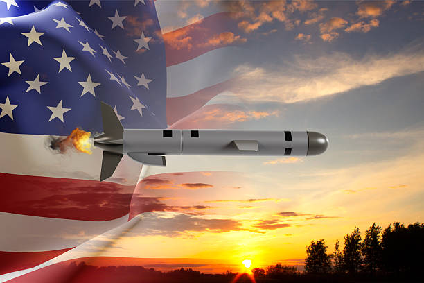 Anti-ballistic rockets launched from ground platforms in front of a proudly waving US flag. / You can see the animation movie of this image from my iStock video portfolio. Video number: 2223591426