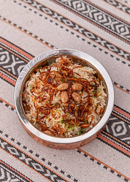 Arabic Chicken biriyani rice dish served with cashew nuts and onions