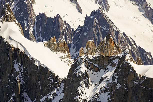 istock The mountain range is covered in snow and rocks 2245544497