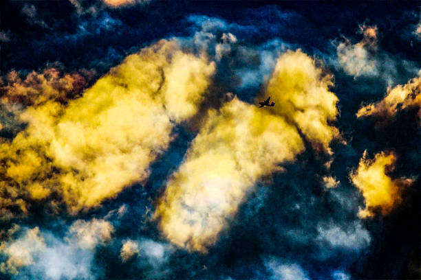 A lone aircraft cuts through a sky ablaze with golden clouds and dramatic twilight hues in Sydney, NSW, Australia. (Photo by Tara Chand Malhotra)