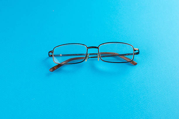 istock Modern Eyeglasses on a Bright Blue Background: Minimalist Style and Vision Focus 2245551300