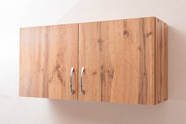 Modern Wooden Kitchen Cabinet with Metal Handles on Textured Wall