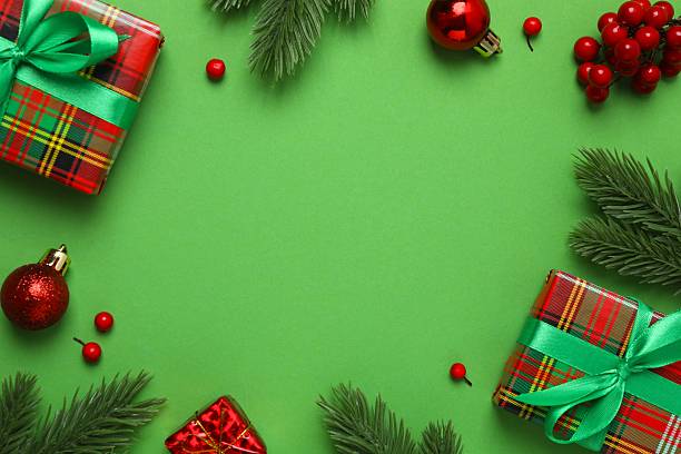 istock Festive Christmas flat lay with decorations on a dark green background. View from above, vertical composition 2245552023