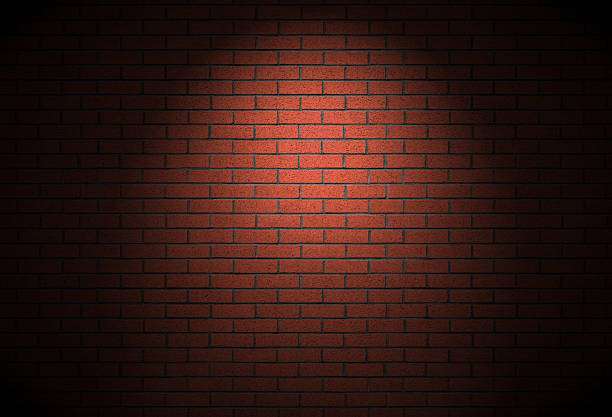 istock Night time street light on brick wall - dark alley background texture 2245552735