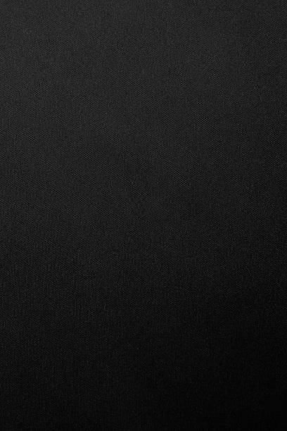 istock Black silk satin. Shiny smooth fabric. Soft folds. Luxury background with space for design. Flat table, top view 2245552972