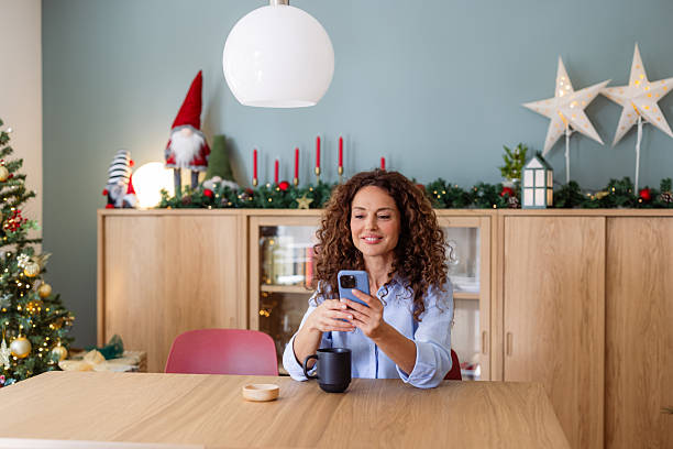 istock Woman using smartphone at home during holidays 2245553202