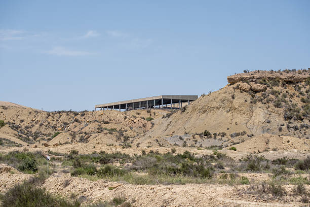 istock Desert landscape with abandoned structure under clear blue sky 2245553279