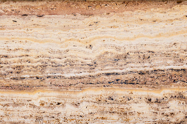 istock Detailed close-up of natural brown marble texture with layered patterns 2245554577