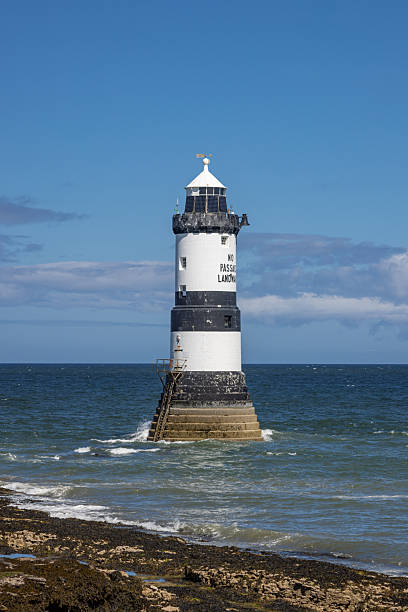 istock The black and white stripped Penmon Lighthouse on the Isle of Anglesey. 2245555424