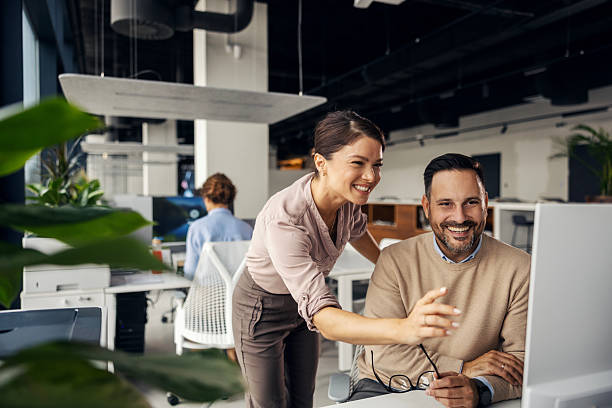 istock Business colleagues collaborating on computer in modern office 2245557128