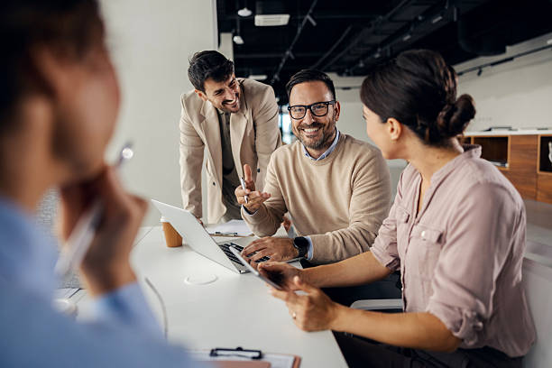 istock Business colleagues collaborating during a corporate office meeting 2245557745