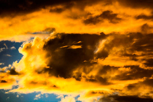 istock Dramatic skies paint a golden and stormy masterpiece 2245558988