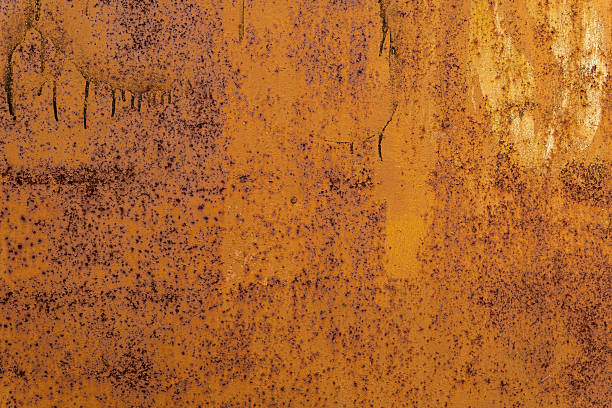 istock Rust texture abstract close-up with dark streaks and vivid orange-brown colors. 2245559453