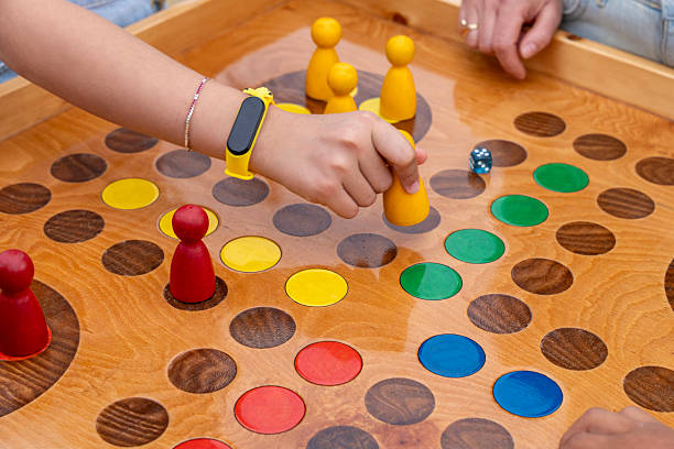 istock Children Playing Colorful Ludo Game 2245560391