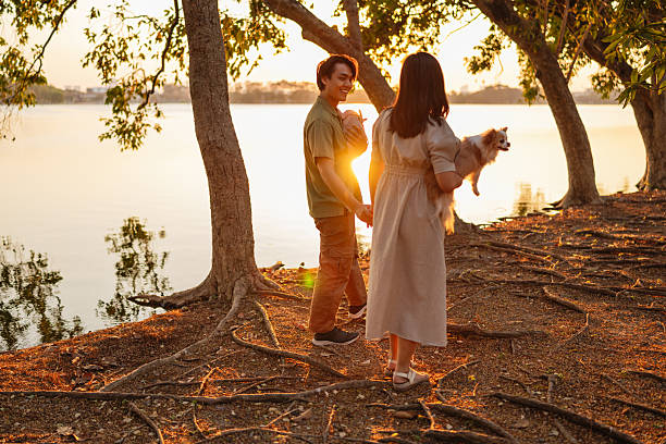 istock Young couple enjoying walk with their pets 2245561255