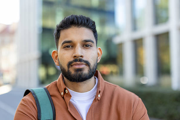 istock Young indian man looking at camera confidently 2245561346