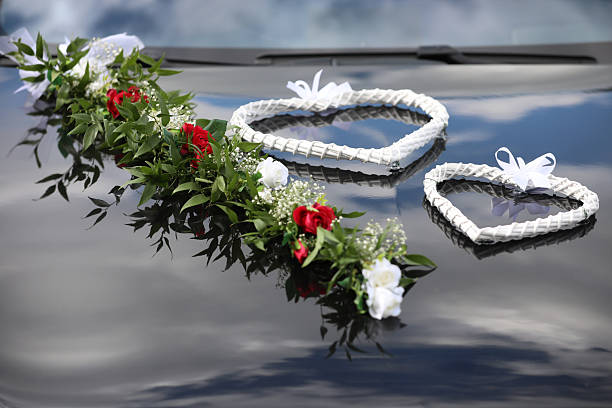 A closeup shot of yellow roses on a hearse car