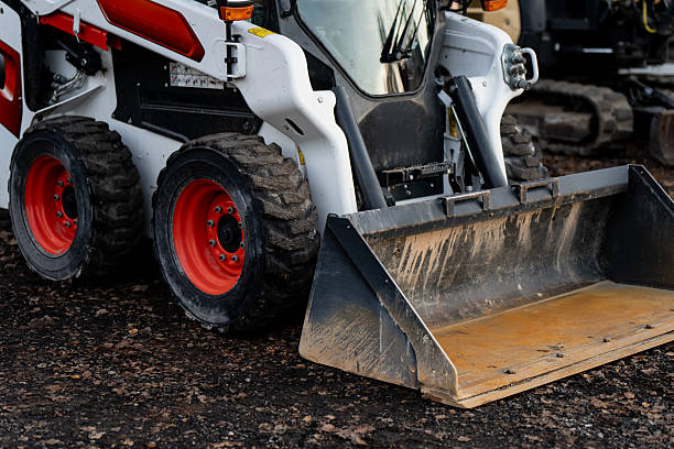 Heavy skid steer loader with large front bucket used in construction and industrial projects, showing durable engineering, hydraulic lifting system and mechanical strength of modern machinery