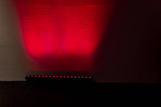 istock LED stage light bar projecting red illumination onto wall showing modern lighting equipment, color technology and visual design application used in professional event and entertainment production 2245564593