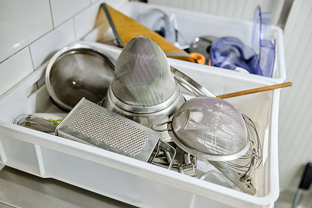 istock Kitchen utensils and tools are piled in a plastic container, showcasing various cooking equipment and tools for culinary preparation and organization 2245566422