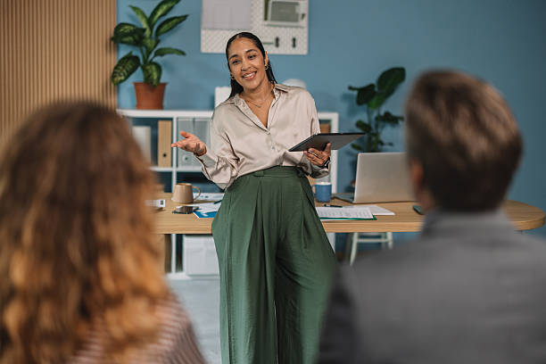 istock Upbeat Speaker Engaging Attentive Audience Members 2245567573