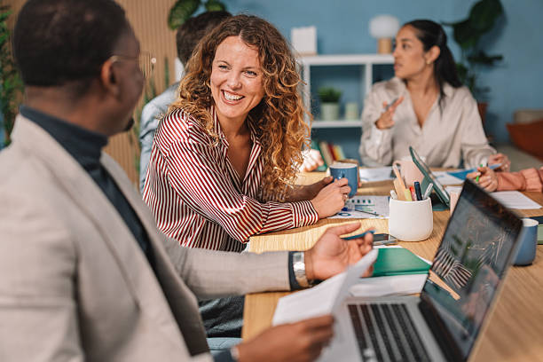 istock Team Meeting with Engaged Discussions and Smiles 2245567729