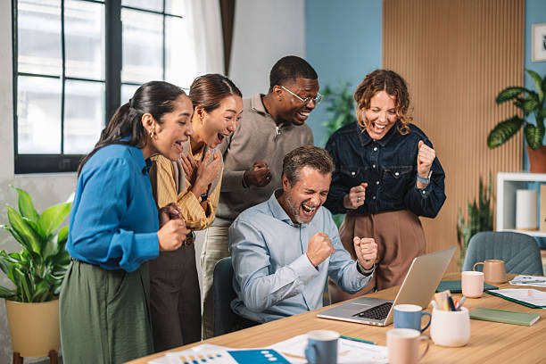istock Happy Team Celebrating Success Together in Office 2245567754