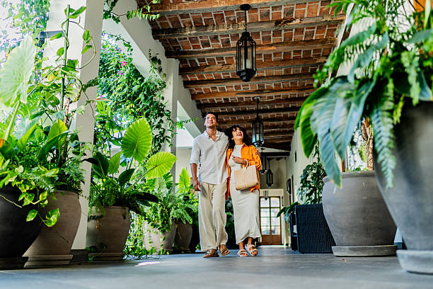 Young couple talking and walking through hotel