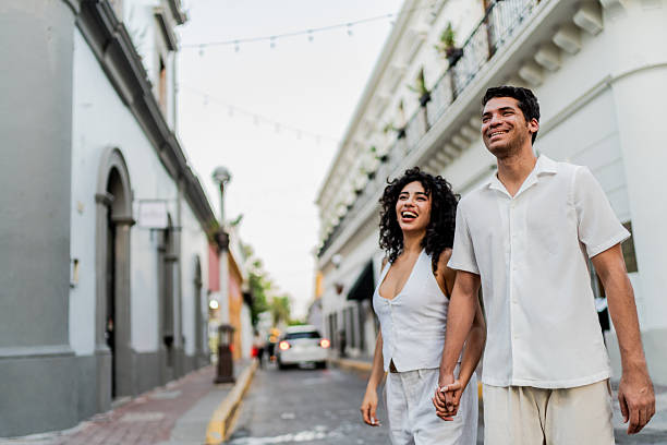istock Young couple walking on the street 2245568472