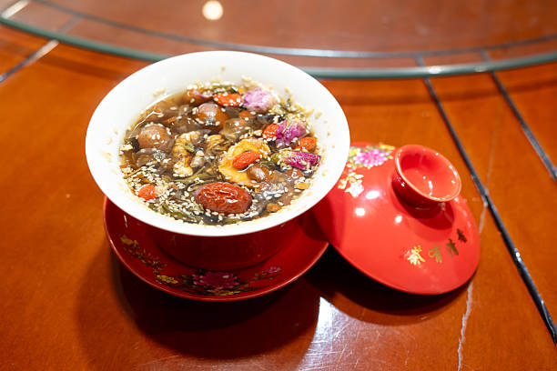 Eight Treasures Tea: In the lidded bowl, red dates, goji berries, and dried longan are added.