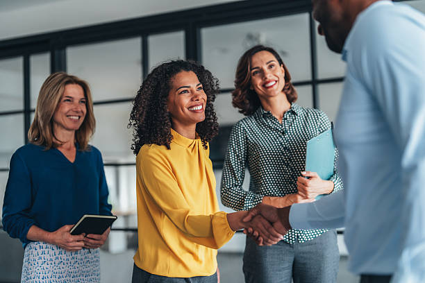 istock Business people shaking hands in the office 2245571931