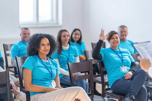 istock Volunteers listening to a presentation and asking questions 2245573997