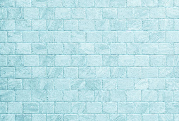 Blue brick concrete stone texture for background in wallpaper. Brick wall and sand stone in plaster of tone vintage. Pattern abstract wall of light cyan color, cement texture mint green for design.