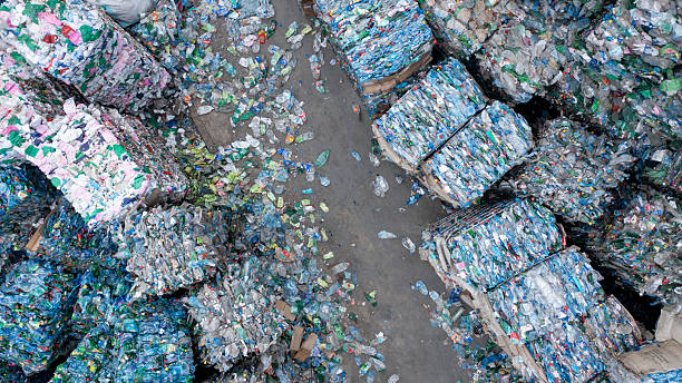 istock Outdoor Recycling Waste Facility With Large Compressed Plastic Bales Stacked 2245574283