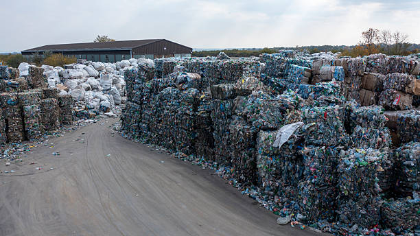 istock Recycling Waste Facility Stacked Large Plastic Bales Outdoors On A Clear Day 2245574305