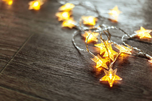 istock Warm glowing star lights create a cozy atmosphere in a dimly lit room 2245579429