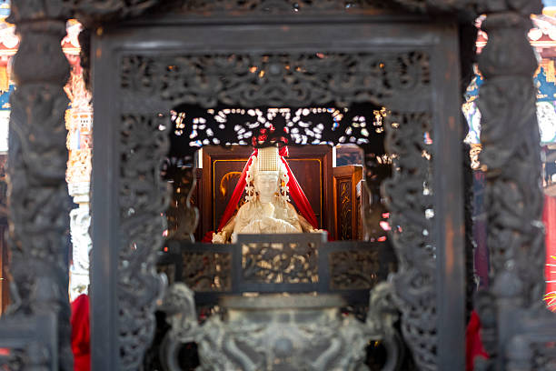 istock Goddess of the Sea: Solemn and Ornate Mazu Statue in an Asian Temple 2245580210