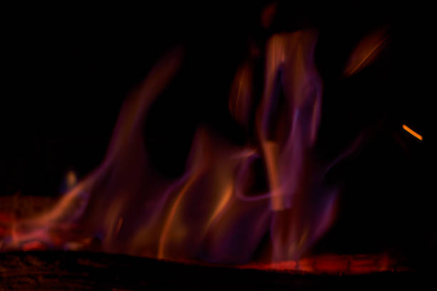 The trail of sparks flying from a bonfire. A depiction of raw energy.